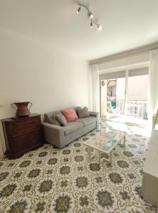 a living room with a couch and a table at Casa del Celo in Rapallo