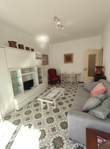a living room with a couch and a table at Casa del Celo in Rapallo
