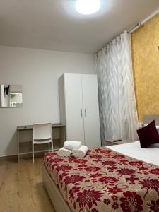 a bedroom with a bed with towels on it at Ca Felisati Venice in Mestre
