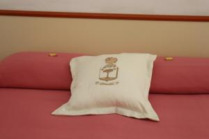 A bed or beds in a room at Meublè Casa Mannini Rooms