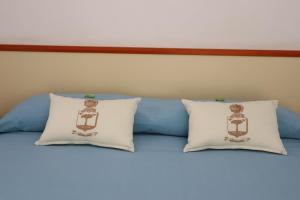 A bed or beds in a room at Meublè Casa Mannini Rooms
