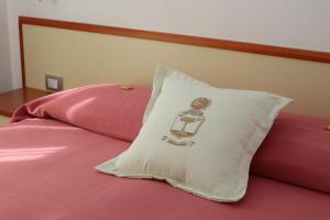 A bed or beds in a room at Meublè Casa Mannini Rooms