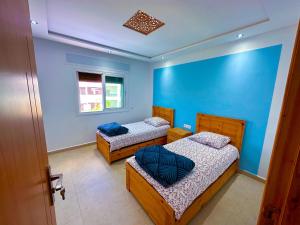 A bed or beds in a room at Luxurious Scandinavian-style, pool & play area