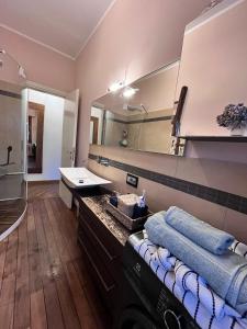 a bathroom with a sink and a mirror at AliRiHome in Rapallo +6 photos