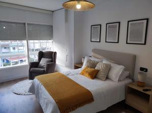 Кровать или кровати в номере Apartamento Illa Salvora, Portonovo