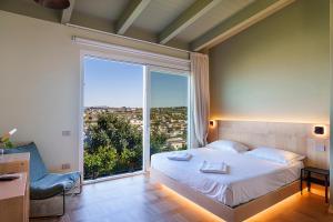 Postel nebo postele na pokoji v ubytování Uefio - Luxury Suites