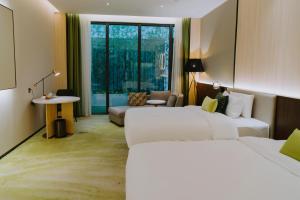 Postelja oz. postelje v sobi nastanitve Wuhan Hazens Hotel