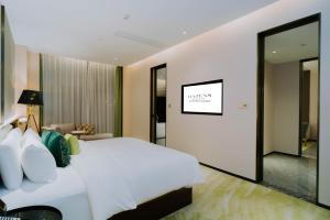 Postelja oz. postelje v sobi nastanitve Wuhan Hazens Hotel