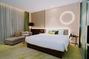 Postelja oz. postelje v sobi nastanitve Wuhan Hazens Hotel