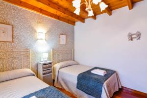 Posteľ alebo postele v izbe v ubytovaní Cómoda casa en entorno natural y cerca de la playa