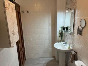 a white bathroom with a sink and a mirror at PUERTO I Playa in Fuengirola +34 photos
