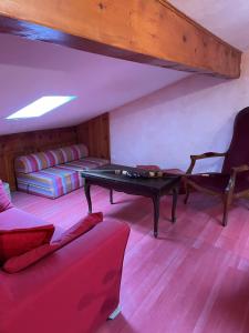 a living room with a ping pong table and a couch at Chalet familial cerdan à Dorres in Dorres