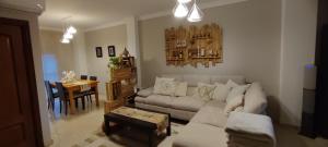 a living room with a couch and a table at Apartamento Acogedor con Mucha Luz in Brenes