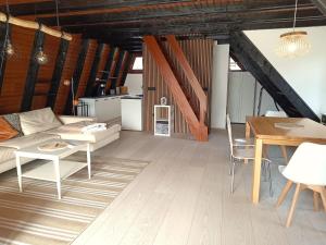 a living room with a couch and a table at Ferienhaus Freilingen in Blankenheim