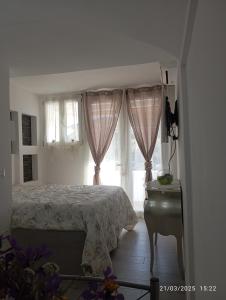 A bed or beds in a room at Da Lucia - Alloggio turistico Santa Maria