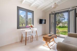 a living room with a table and a couch at Cuckoos House in Aegina Town