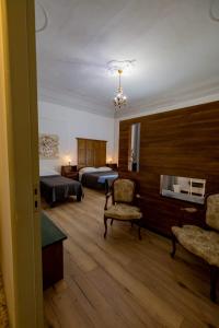 Postel nebo postele na pokoji v ubytování B&B Domus Enna