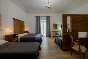 Postel nebo postele na pokoji v ubytování B&B Domus Enna