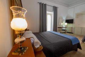 Postel nebo postele na pokoji v ubytování B&B Domus Enna
