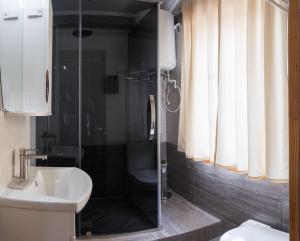a bathroom with a shower and a sink at Lakeside Villa Issyk Kul in Cholpon-Ata +25 photos