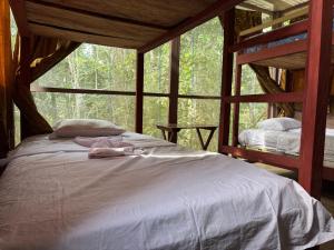 a bedroom with a bed in a tree house at Estación Biológica Santa María de Fátima II Zona in Iquitos