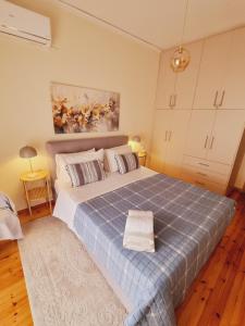 Postel nebo postele na pokoji v ubytování City Life Apartment