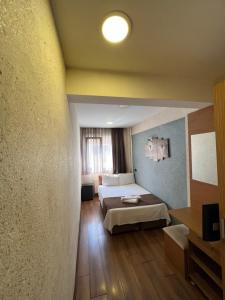 Postel nebo postele na pokoji v ubytování Okur Otel + 37 fotografií