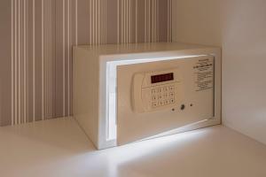 a microwave oven with its door open on a shelf at Louren Apartments in Prague
