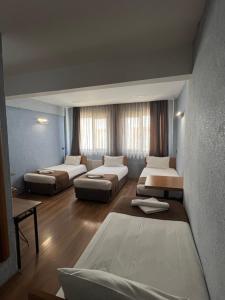 Postel nebo postele na pokoji v ubytování Okur Otel