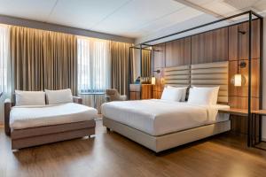 Postel nebo postele na pokoji v ubytování AC Hotel by Marriott Stockholm Ulriksdal