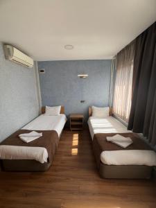 Postel nebo postele na pokoji v ubytování Okur Otel