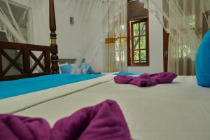 Letto o letti in una camera di Azure Resort Mirissa
