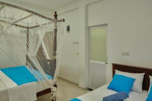 Letto o letti in una camera di Azure Resort Mirissa