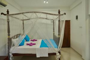 Letto o letti in una camera di Azure Resort Mirissa