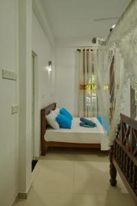 Letto o letti in una camera di Azure Resort Mirissa