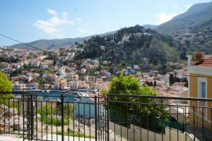 a view of a city from a balcony at Panoramic View House in Symi