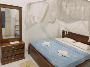 Postel nebo postele na pokoji v ubytování Villa Utopia Mirissa