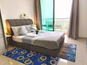 a bedroom with a bed and a large window at C-25-06 Lakeviewsouth Cybersquare WiFi Netflix FreeParking in Cyberjaya +23 photos