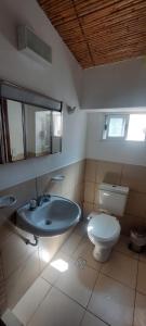 a bathroom with a sink and a toilet at Vidala in Tilcara