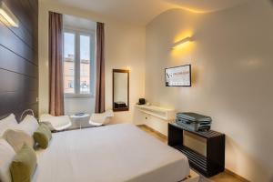 Postel nebo postele na pokoji v ubytování Navona Stay + 37 fotografií