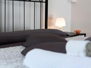 Cama o camas de una habitación en Manzoni Holiday Apartment
