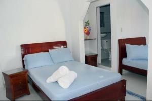 Postel nebo postele na pokoji v ubytování Hotel Los Delfines Melgar + 15 fotografií