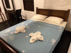Postel nebo postele na pokoji v ubytování Villa Utopia Mirissa