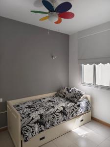 a bedroom with a bed with a ceiling fan at Miramar Atlántico Playa in Los Llanos de Aridane +6 photos
