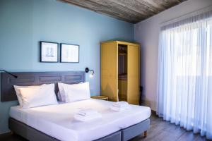 Voodi või voodid majutusasutuse Chapter 5 Hotel toas