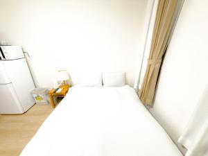 Postel nebo postele na pokoji v ubytování ホテル サンフェリシアン京都四条烏丸