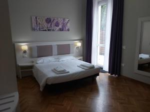 Postel nebo postele na pokoji v ubytování Lodges le Mura