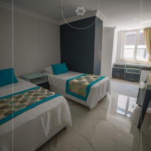 Ένα ή περισσότερα κρεβάτια σε δωμάτιο στο Homes Global