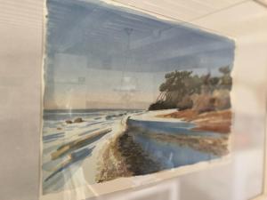 a painting of the ocean on a wall at VasaLodge Sälen in Sälen