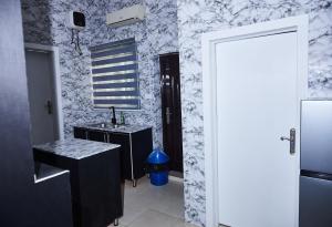 Kuchyň nebo kuchyňský kout v ubytování Tee-whyte private home + 10 fotografií
